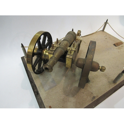 311 - A cannon mounted onto a base supported by bullet shell corners     (R) £40