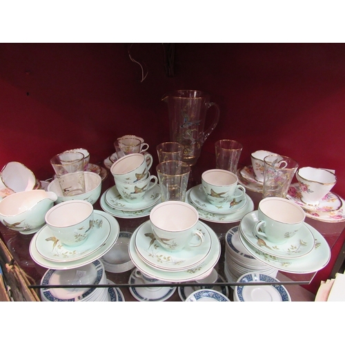 314 - Part tea services and a glass lemonade set