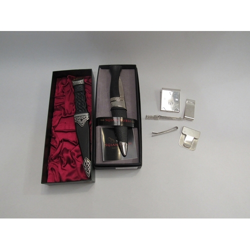 325 - Two ceremonial Sgian Dubh daggers, boxed two silver items to include a money clip marked London, a M... 