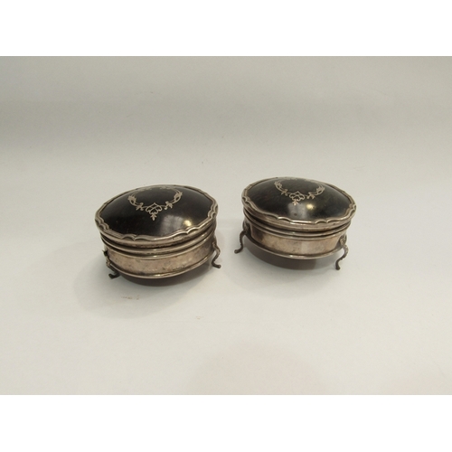 341 - A pair of silver and tortoiseshell trinkets pots on feet, one a/f     (R) £60