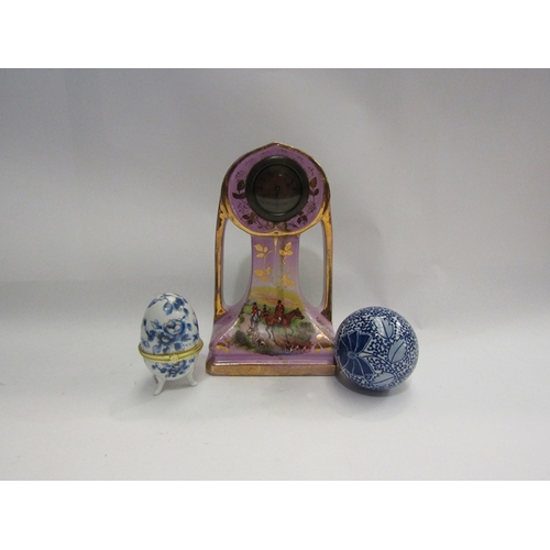 449 - An early 20th Century Art Nouveau timepiece, blue and white carpet bowl and egg form ring box (3)