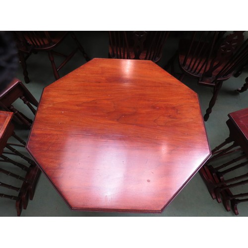 450 - An Edwardian mahogany octagonal occasional table on turned legs and castors with fretwork under tier... 