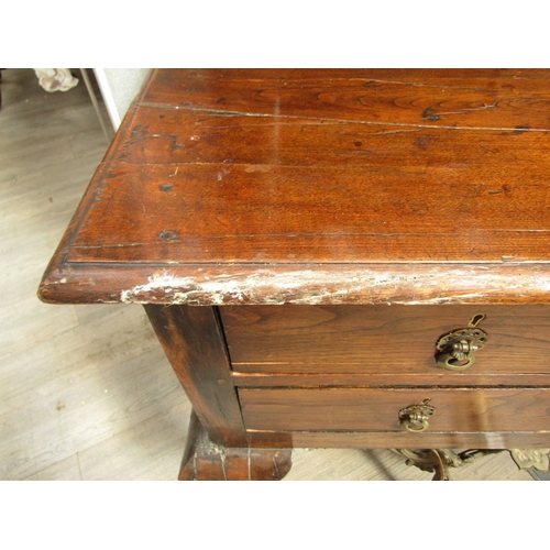 1054 - An 18th Century Continental oak dresser, bobbin-turned supports to plate rack back, four drawers and... 