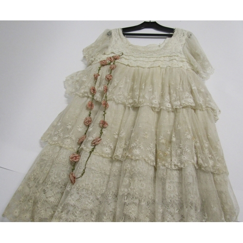 1235 - 1920's child's cream lace dress, tiered frill design together with a 1920's mushroom coloured silk d... 