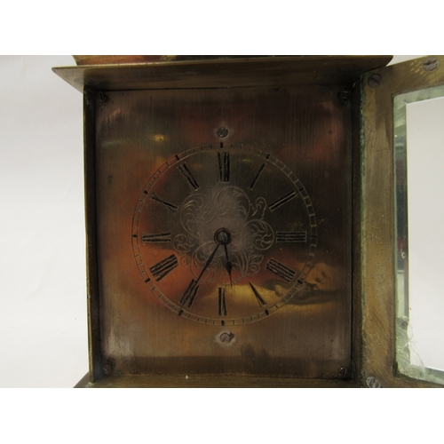 1365 - A small early 19th Century carriage clock, ca. 1825, brass case, silvered dial with central engravin... 