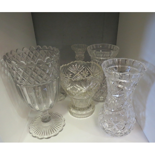 1300 - A selection of decorative glassware, mainly vases and a pair of candlesticks (6)