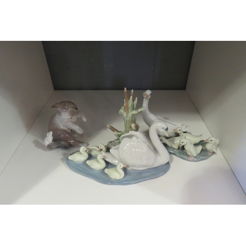 1302 - Three Lladro figures, swans and cygnets, geese and goslings and cat and mouse