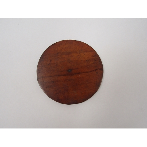 1317 - A 19th Century marquetry disc depicting drinking man, 8.5cm diameter