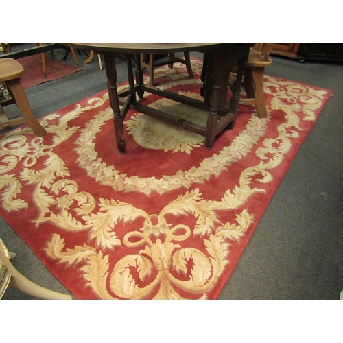 1538 - A large Chinese wool rug, red velvet ground with floral decoration, 280cm x 182cm