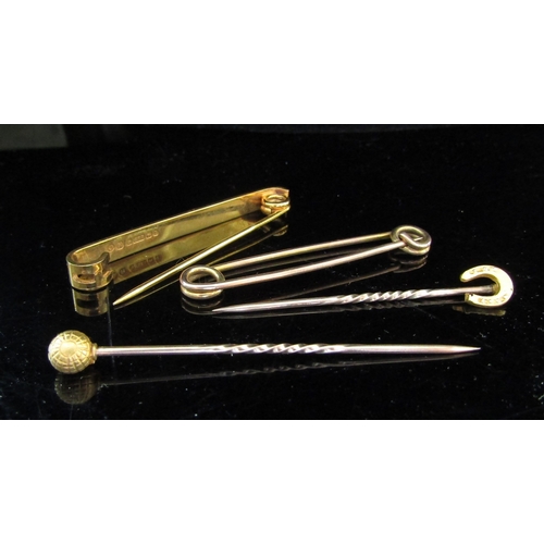 5067 - Two 9ct gold bar/tie pins and two stick pins, one sperical the other horseshoe finial, 6g    (R) £60