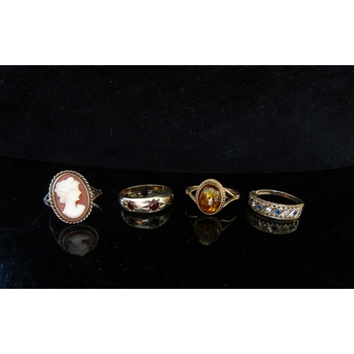 5075 - Four 9ct gold rings including cameo and amber, 106g