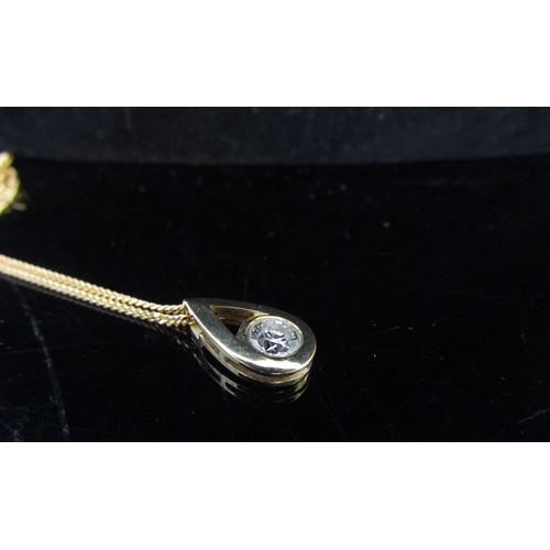 5078 - An 18ct gold pendant with a 0.50ct approx diamond, hung on an 18ct gold chain, 50cm long, 4g