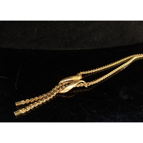 5079 - A gold necklace with ribbon swag and tassel front, stamped 585, 50cm long, 18.8g