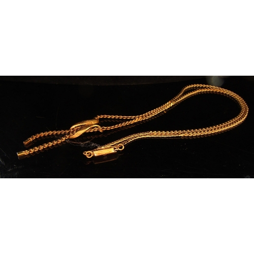 5079 - A gold necklace with ribbon swag and tassel front, stamped 585, 50cm long, 18.8g