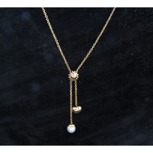 5085 - A gold necklace hung with a single pearl and sweetheart drop, stamped 585, 46cm long, 3.3g