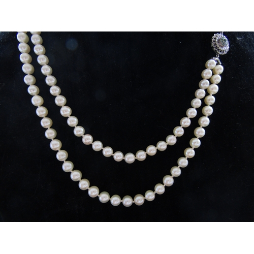 5087 - A single strand pearl necklace, 5mm pearls, 46cm long with a 9ct gold pearl and citrine set clasp