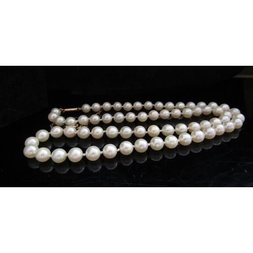 5089 - A single strand pearl necklace, 5mm pearls, 48cm long with a gold clasp stamped 9ct and safety chain