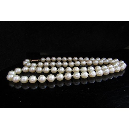 5089 - A single strand pearl necklace, 5mm pearls, 48cm long with a gold clasp stamped 9ct and safety chain