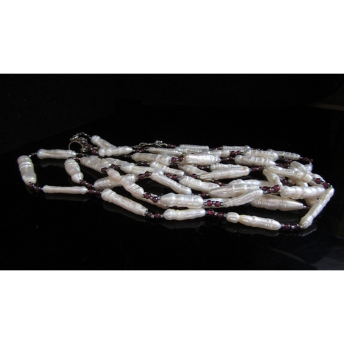 5090 - A three strand fresh water pearl and ruby bead necklace