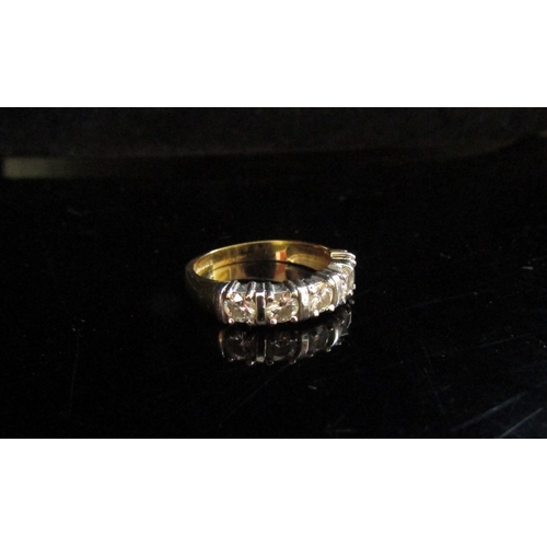 5095 - An 18ct gold ring set with five clear stones. Size K/L, 3.7g