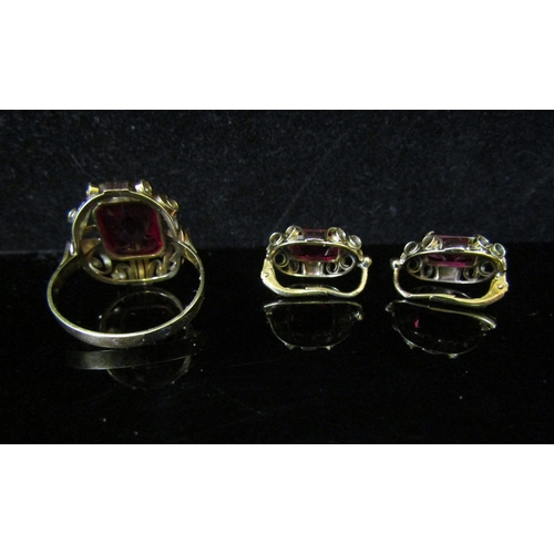 5109 - A synthetic ruby ring. Size U, 5g with a pair of matching earrings stamped 585, 4.7g    (R) £200