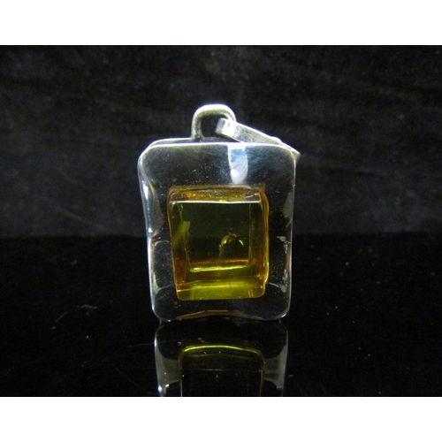 5111 - A modern pendant with polished square amber with insect insert, marked 925