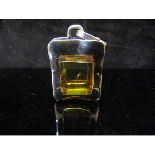 5111 - A modern pendant with polished square amber with insect insert, marked 925