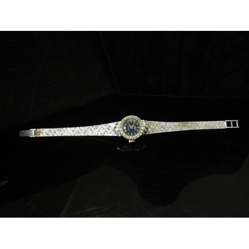 5112 - An 18ct white gold Bucherer lady's wristwatch, brick link strap and diamond set bezel, 26.2g   (C)