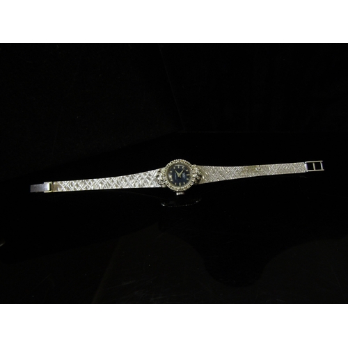 5112 - An 18ct white gold Bucherer lady's wristwatch, brick link strap and diamond set bezel, 26.2g   (C)