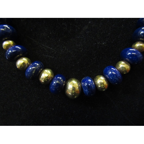 5115 - A Lapis Lazuli and gold bead necklace purchased from The Cataract Hotel, Aswan, 46cm long