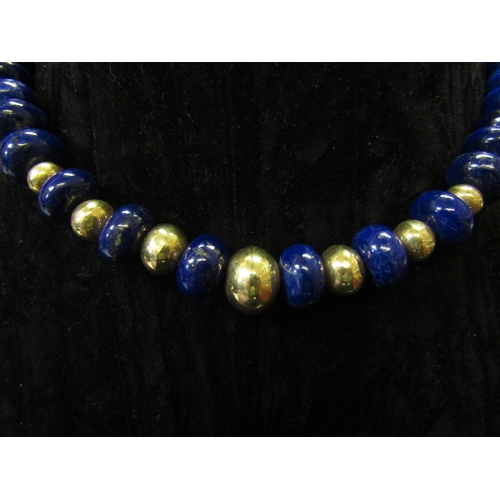 5115 - A Lapis Lazuli and gold bead necklace purchased from The Cataract Hotel, Aswan, 46cm long