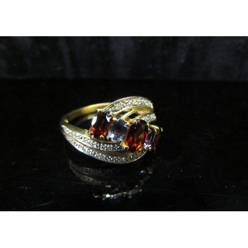 5117 - A garnet, sapphire and diamond chip dress ring, stamped 375. Size Q, 2.8g  (C)