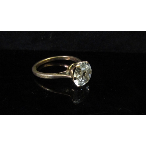 5155 - A gold ring set with large clear round stone, stamped 9ct. Size O, 2.9g