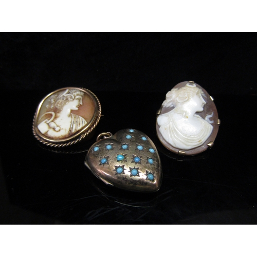 5157 - Two carved shell cameo brooches and a heart shaped double photograph locket set with turquoise, all ... 