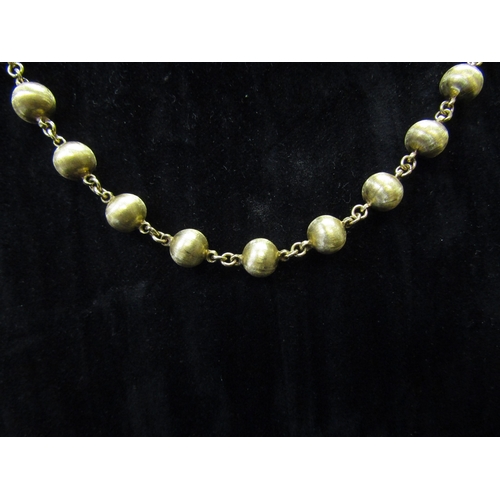 5160 - A gold bead necklace stamped 585, 62cm long, 35.2g