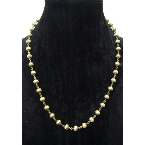 5160 - A gold bead necklace stamped 585, 62cm long, 35.2g