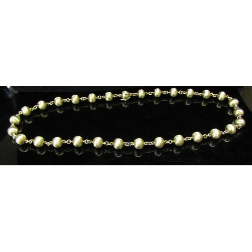 5160 - A gold bead necklace stamped 585, 62cm long, 35.2g