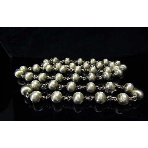 5160 - A gold bead necklace stamped 585, 62cm long, 35.2g