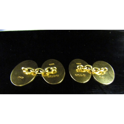 5166 - A pair of 18ct gold cufflinks, 10.4g