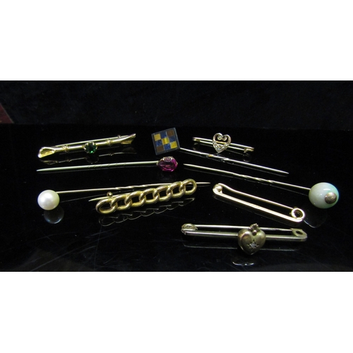 5173 - A collection of bar brooches and stick pins including 9ct and 15ct examples