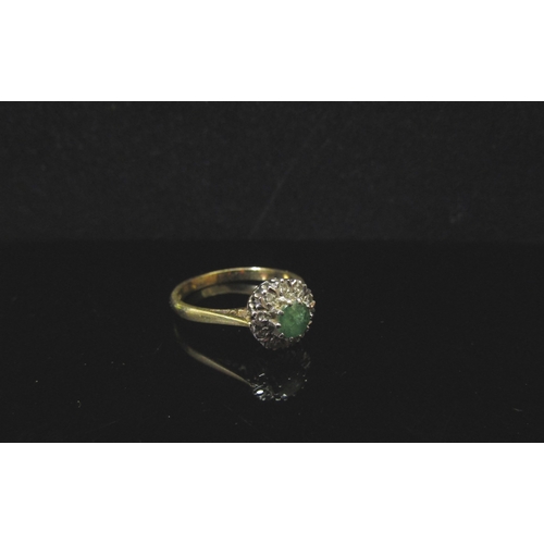 5180 - An 18ct gold emerald and diamond cluster ring. Size N/O, 3.3g  (C)