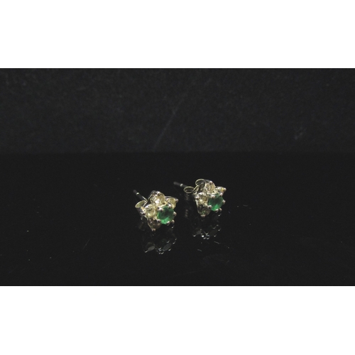 5181 - A pair of 18ct white gold emerald and diamond stud earrings, 1.6g