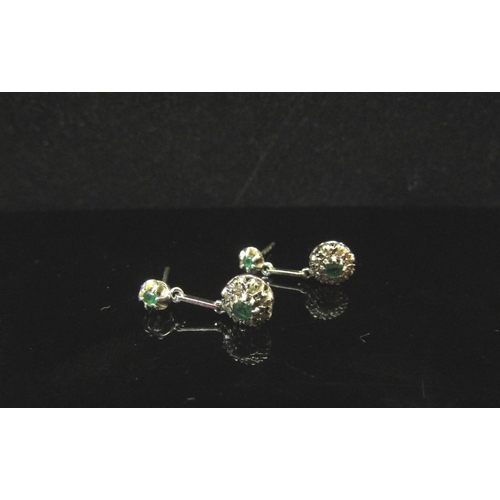 5182 - A pair of 9ct white gold emerald and diamond drop earrings, 1.6g