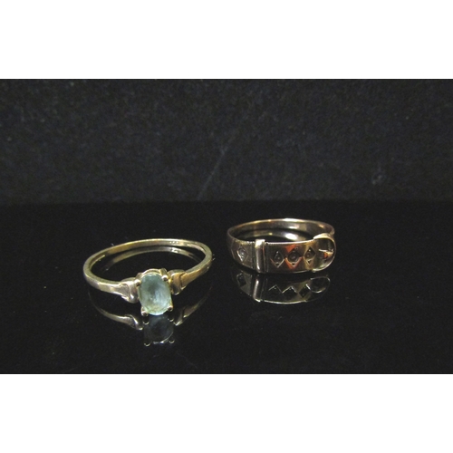 5184 - A 9ct gold buckle ring, worn, stones missing, 1885 and an aquamarine ring stamped 9ct, 2.2g  (C)