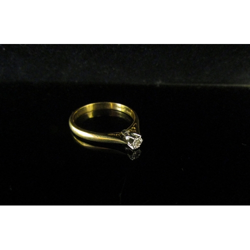 5191 - An 18ct gold diamond solitaire ring set wiith 0.05ct diamond. Size M/N, 2.5g