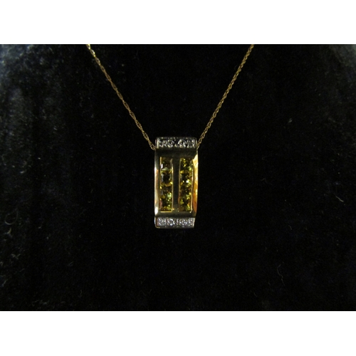 5122 - A yellow sapphire and diamond pendant hung on chain stamped 375, 44cm long, 3.4g   (C)