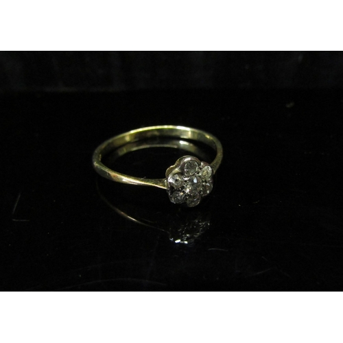 5123 - A gold diamond daisy ring, stamped 10ct. Size N/O, 1.5g   (C