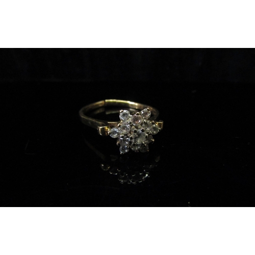 5124 - A gold diamond cluster ring, stamped 10ct, shank split, 2.4g  (C)