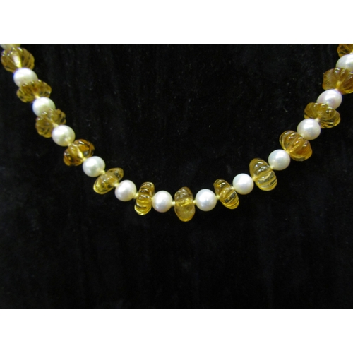 5129 - A carved citrine stone and cultured pearl necklace with gold clasp, 58cm long  (C)