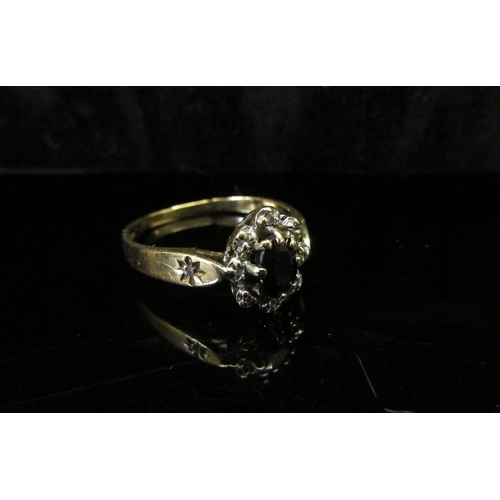 5140 - A 9ct gold sapphire and diamond chip cluster ring. Size N, 2g   (C)